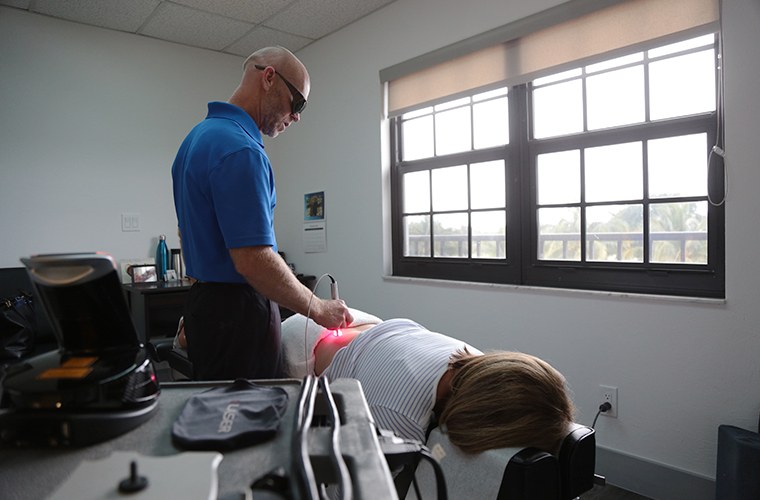 Doctor Wills using advanced chiropractic technology
