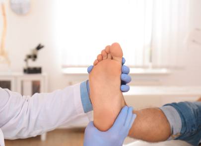 Chiropractor examining a patient's foot