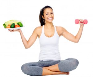 woman holding healthy food and weight to help with back pain